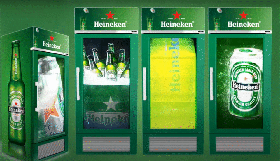 A beverage cooler with a bright LCD ad display in a modern convenience store