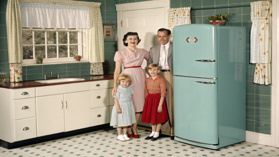 A vintage 1950s family with their new refrigerator