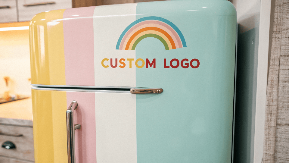 Close-up of a custom logo on the door of a vibrant retro fridge.