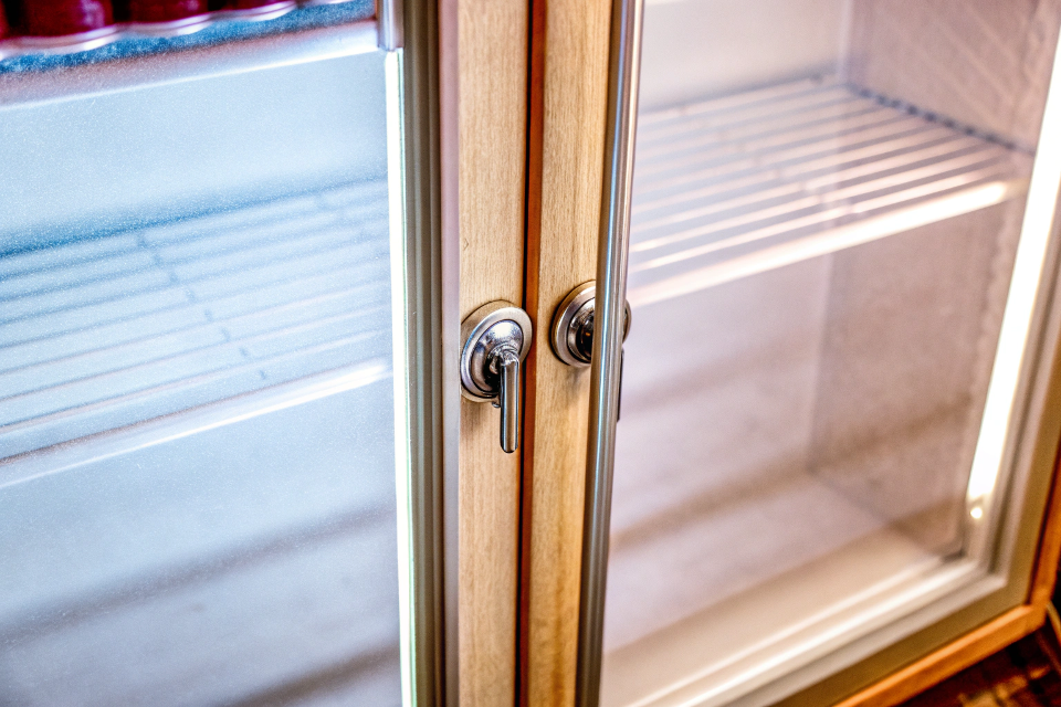 A close-up shot of the double-paned glass door of a beverage cooler