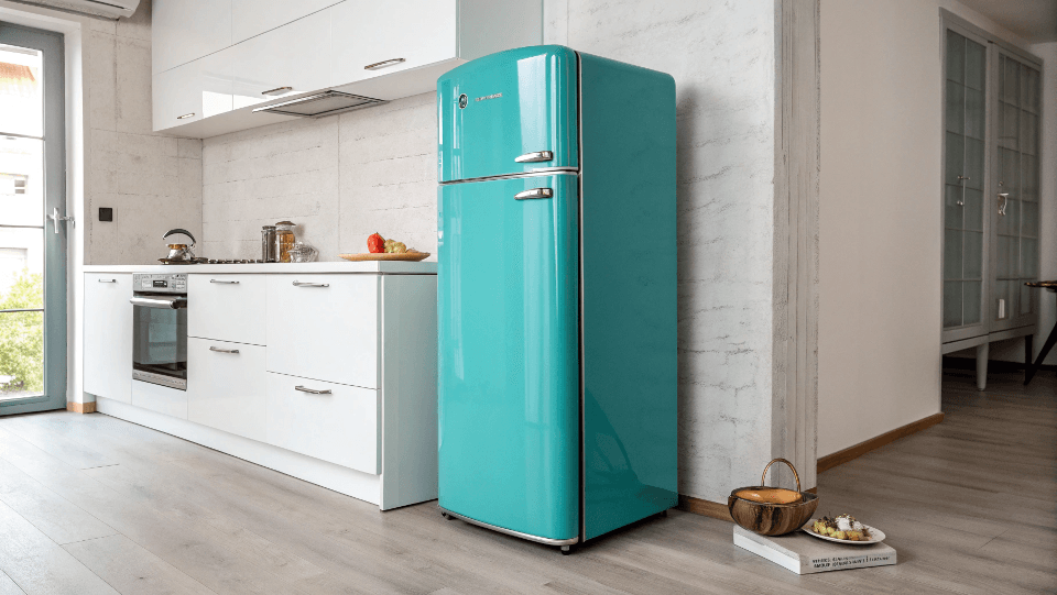 A stylish teal retro refrigerator in a minimalist modern kitchen