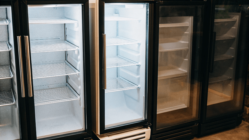 different sized commercial fridges side by side