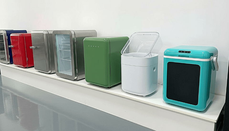 a mini fridge and a full-size fridge side-by-side in a showroom