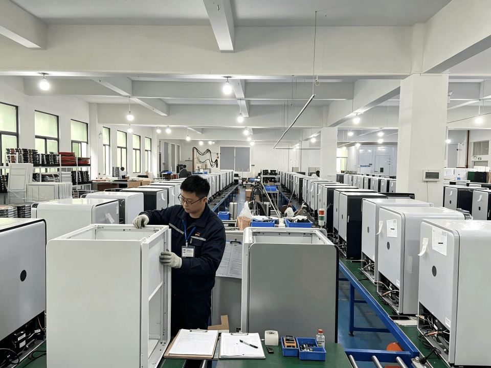 A quality inspector checking a refrigerator on a production line