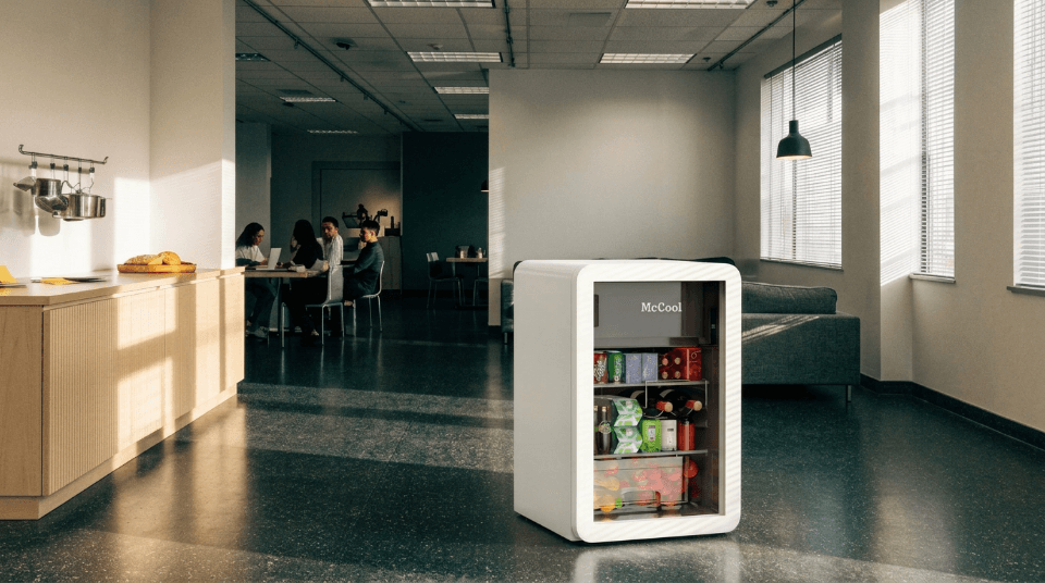 A custom branded fridge with a company logo in a modern office breakroom